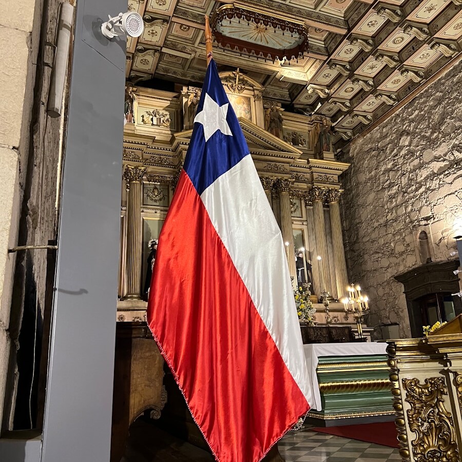 a flag hanging from the ceiling of a building