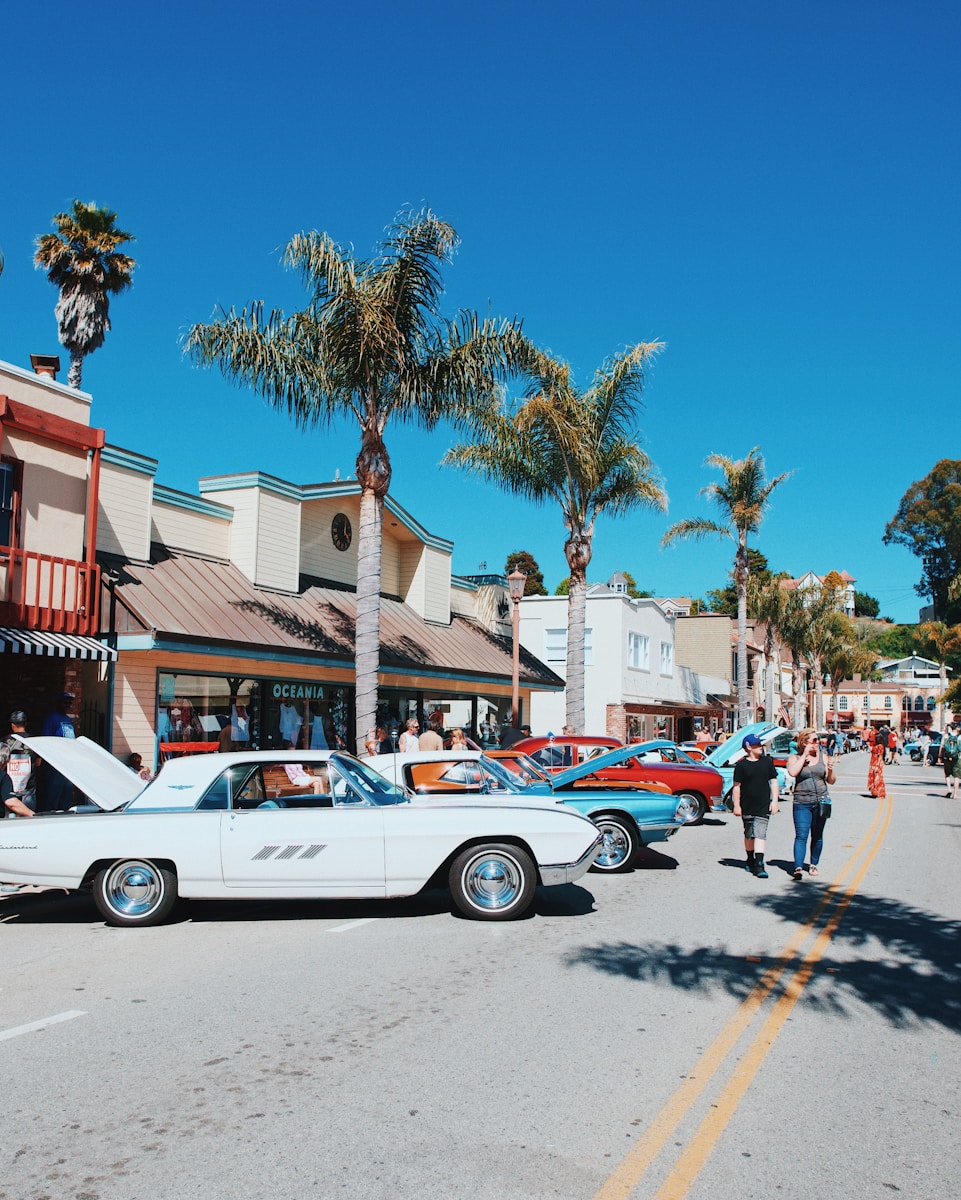 white coupe parked on street during daytime
