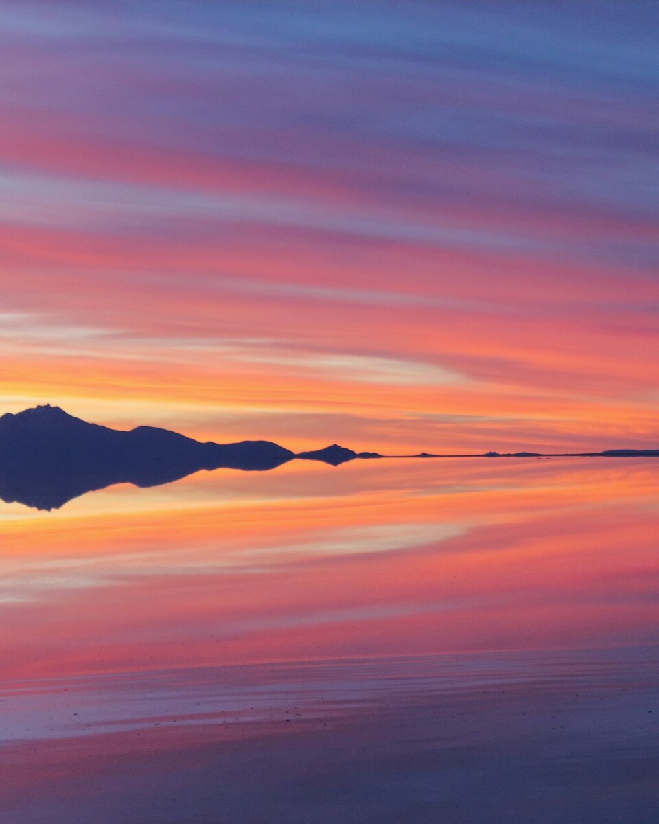 a sunset over a beach