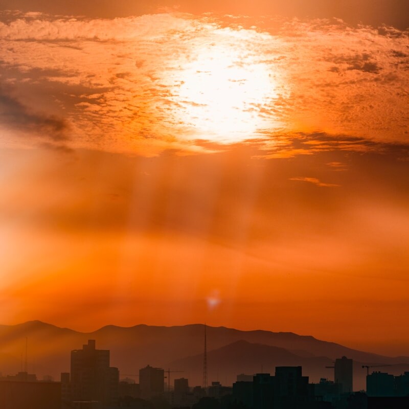 orange sunset above buildings