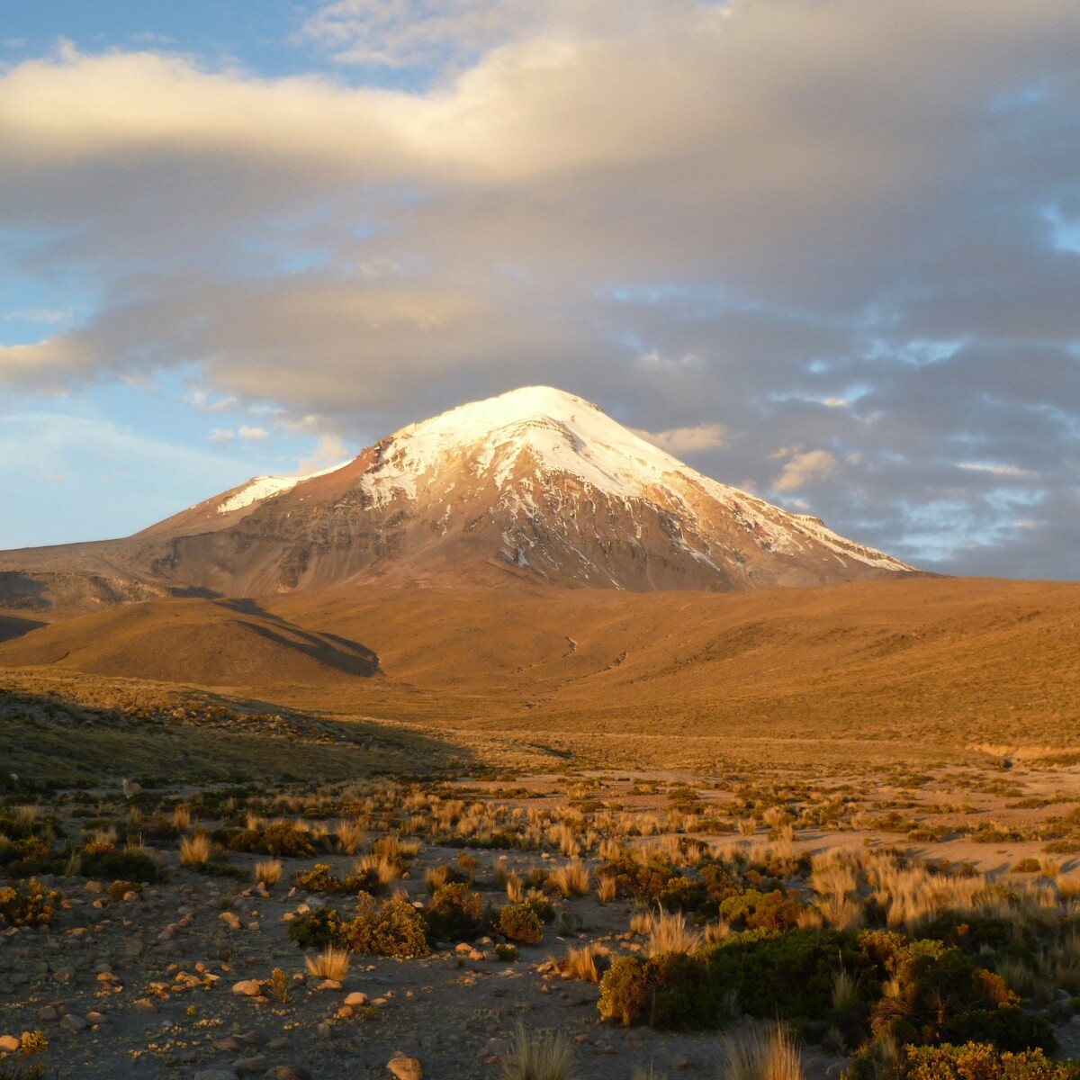 brown and white mountain under white clouds during daytime